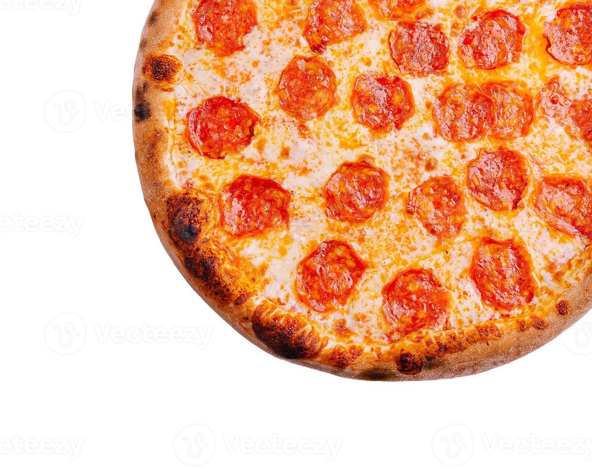 Freshly baked pepperoni pizza on a wooden surface photo