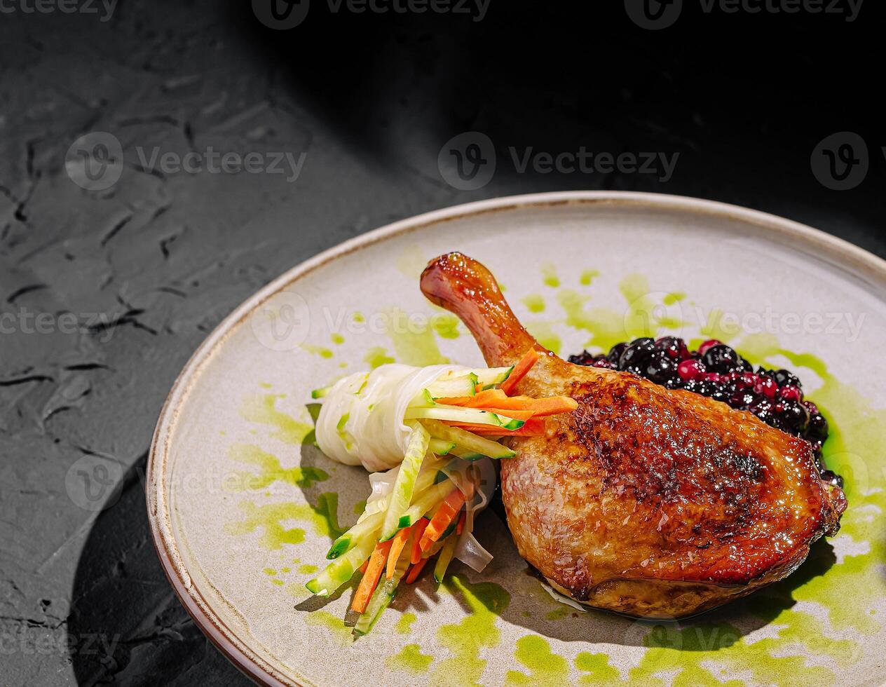 Elegant duck with berry sauce and fresh veggies photo