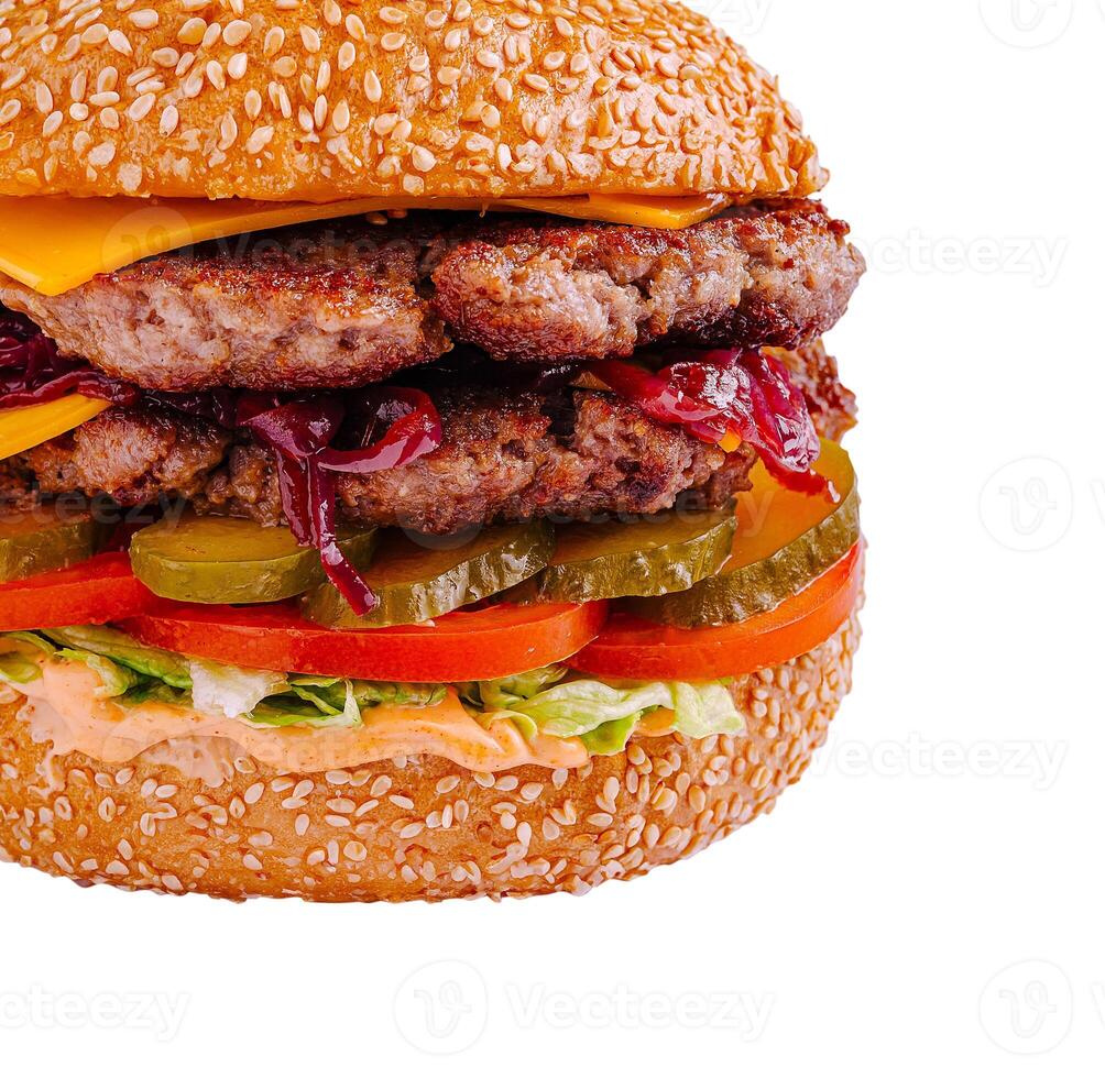 Juicy burger stacked with cheese, pickles, and grilled onions photo
