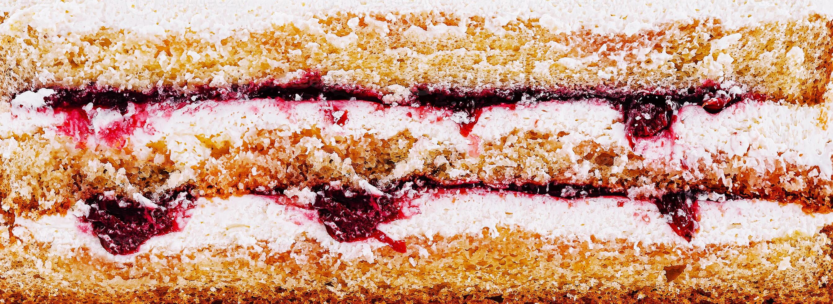 Delicious layered cake with cream and berry filling on display photo
