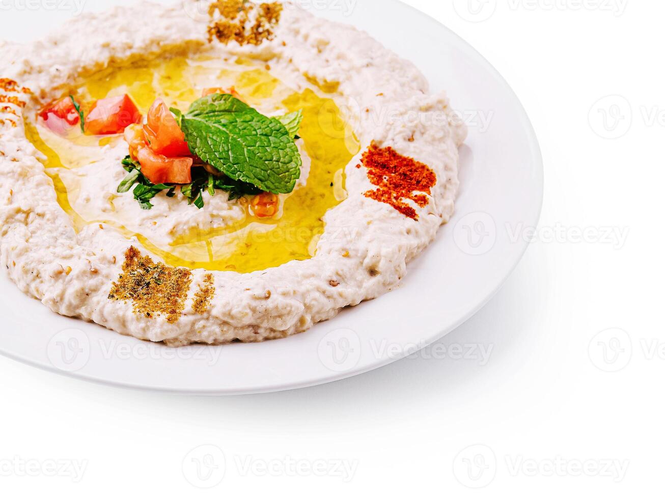 Delicious hummus with olive oil and fresh ingredients for dipping photo