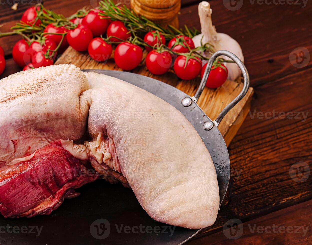 Preparing ingredients for traditional cooking with meat and tomatoes photo