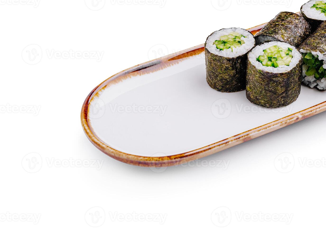 Sushi rolls arranged neatly on a rectangular plate with a minima photo