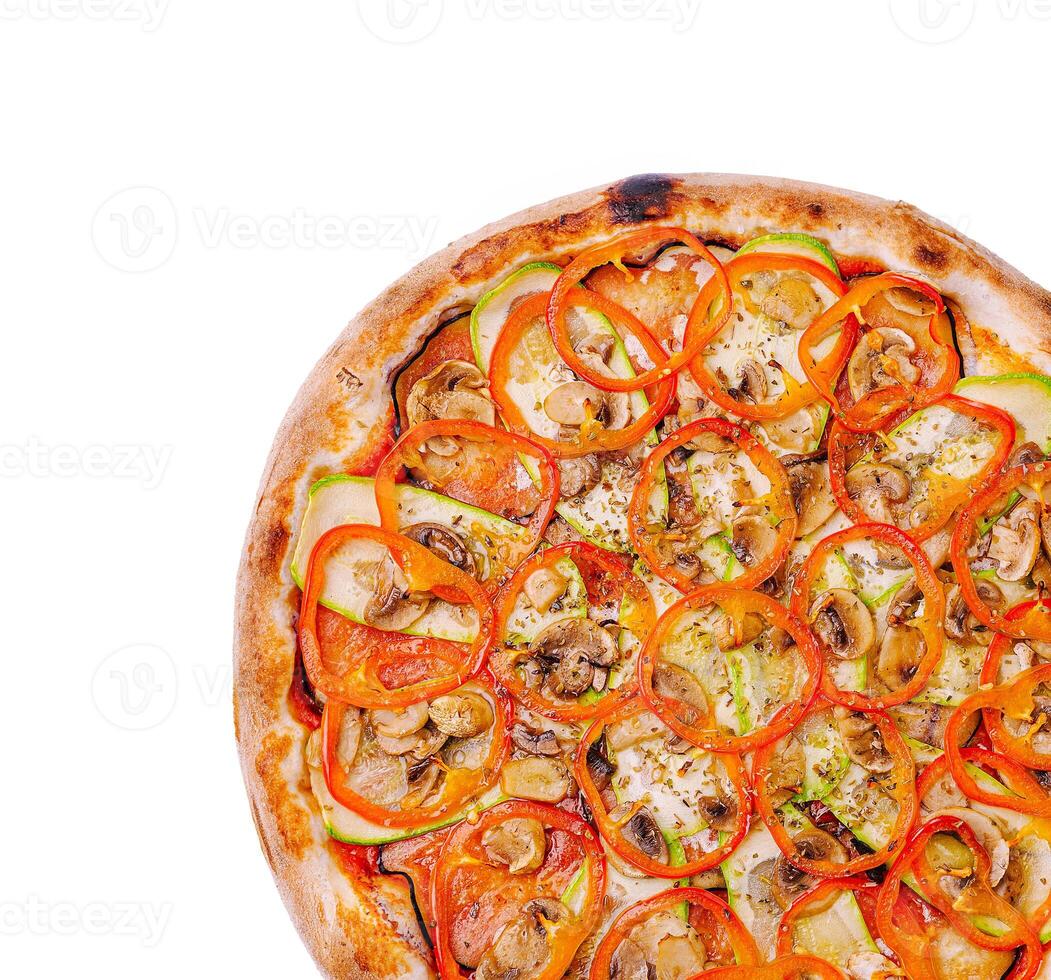 Tasty pizza topped with fresh vegetables and herbs ready to serve photo