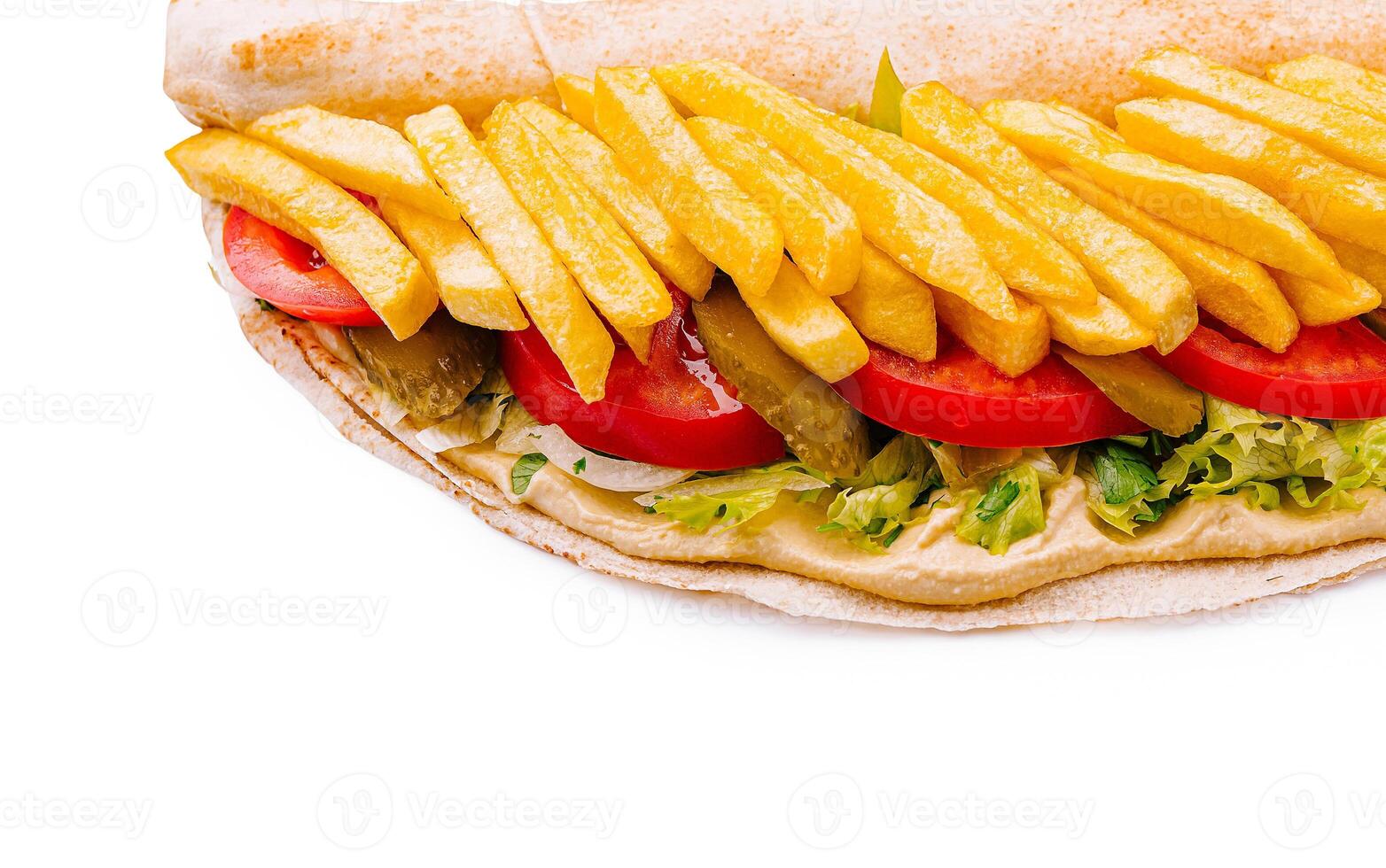 Delicious wrap filled with fresh vegetables and crispy fries photo