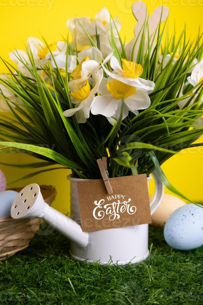 Easter background with yellow flowers colorful eggs and inscription card Happy Easter Vertical photo