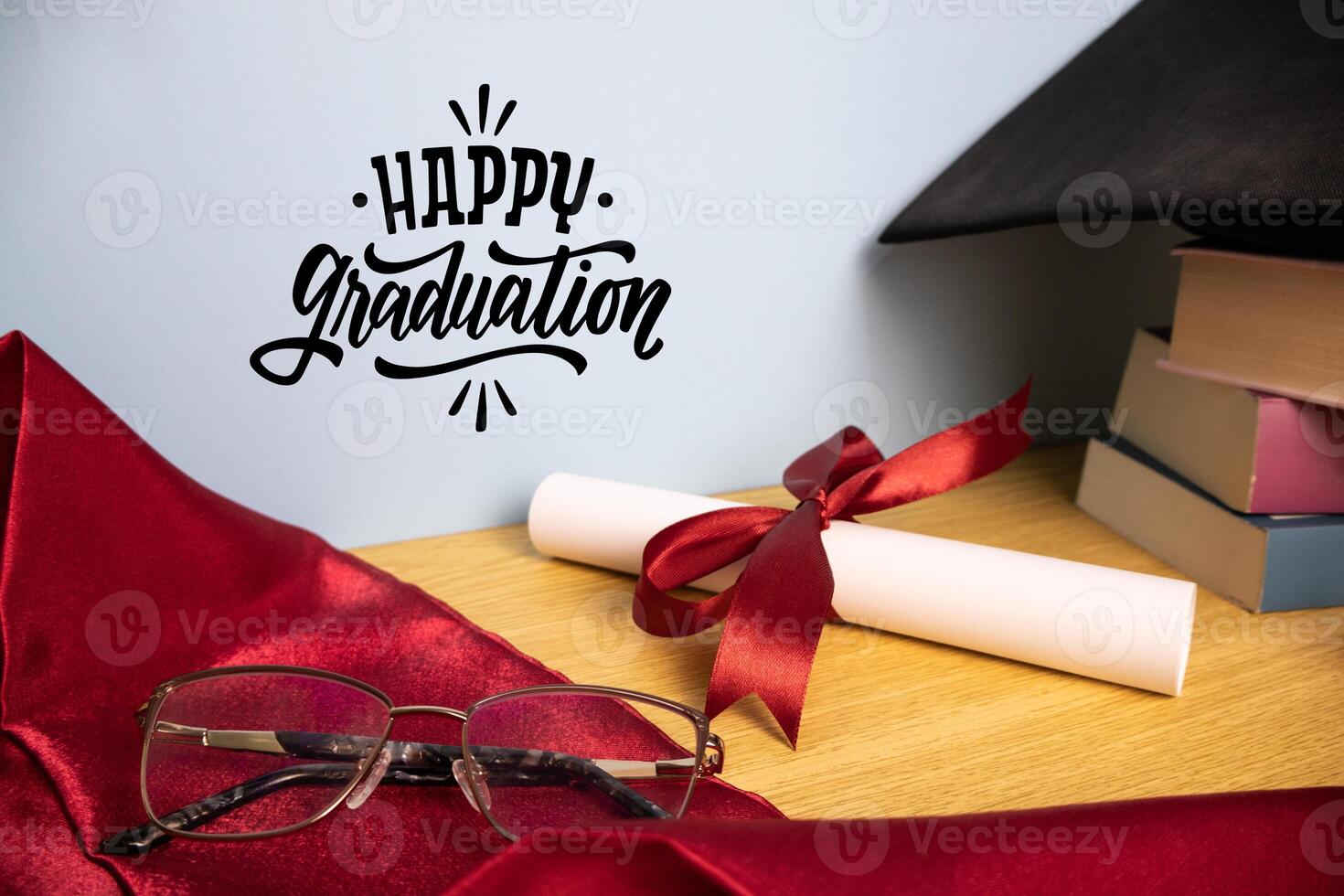 Happy graduation background with academic hat stole diploma and stack of books photo