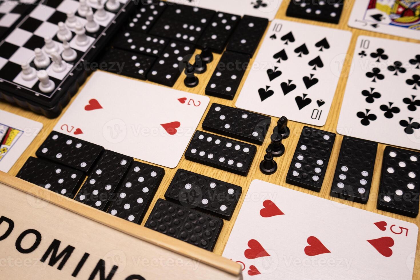 background with domino pieces playing cards chess photo