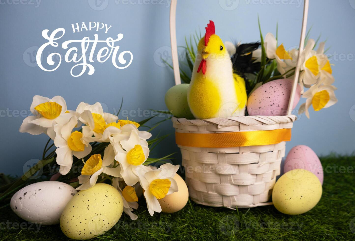 Easter eggs and daffodil flowers close up White basket and chicken in background Happy Easter photo