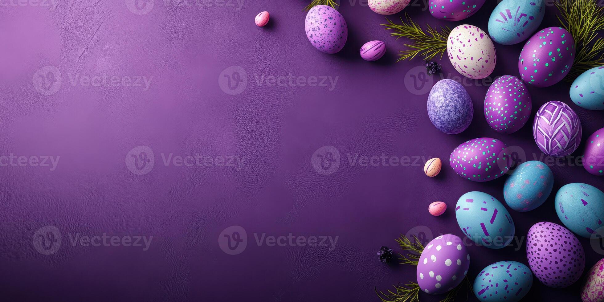 Colorful decorated Easter eggs arranged on a purple background with greenery, perfect for festive celebrations and spring gatherings photo