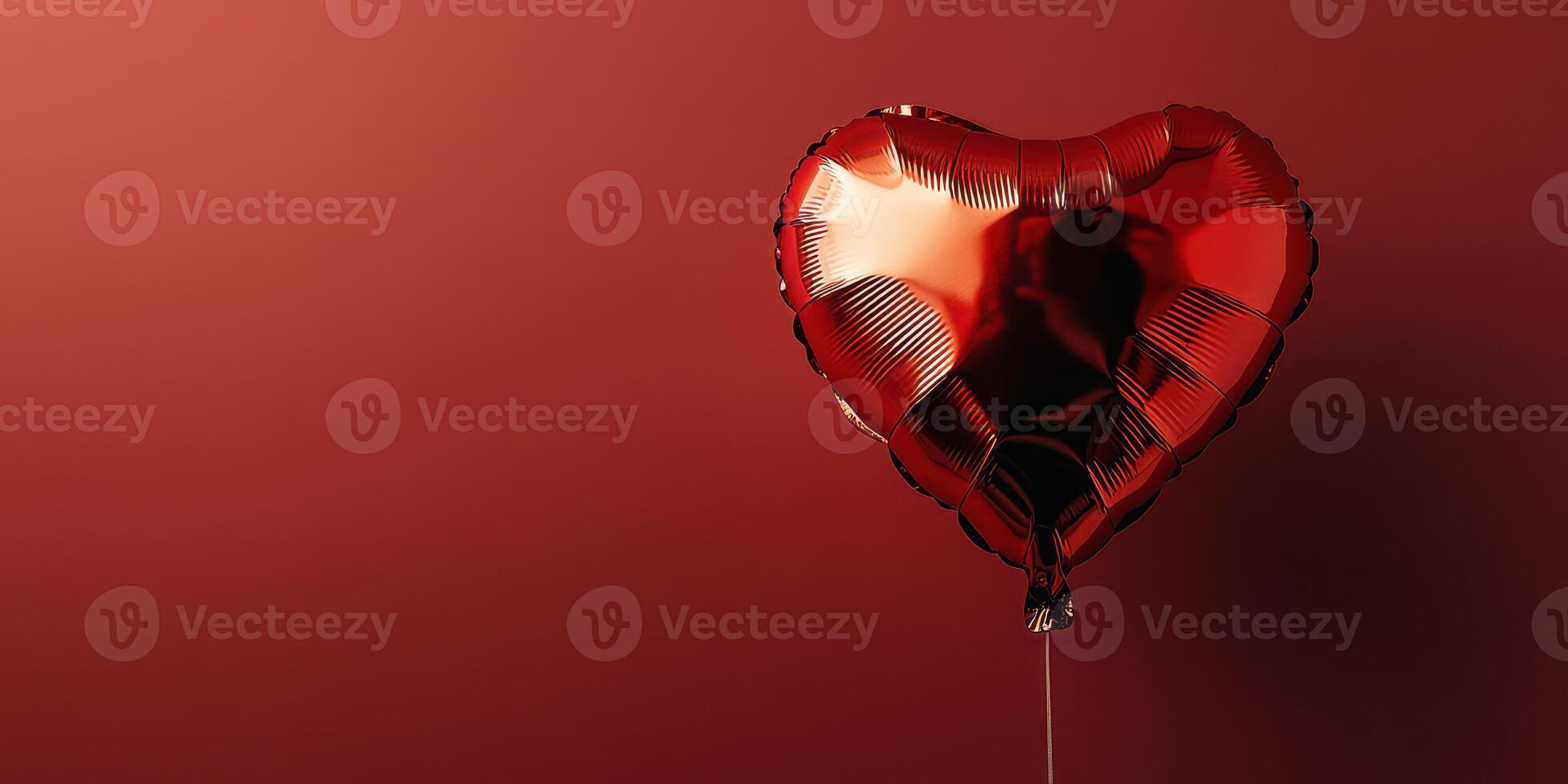 Heart-shaped balloon against a red background creating a romantic atmosphere for special occasions photo