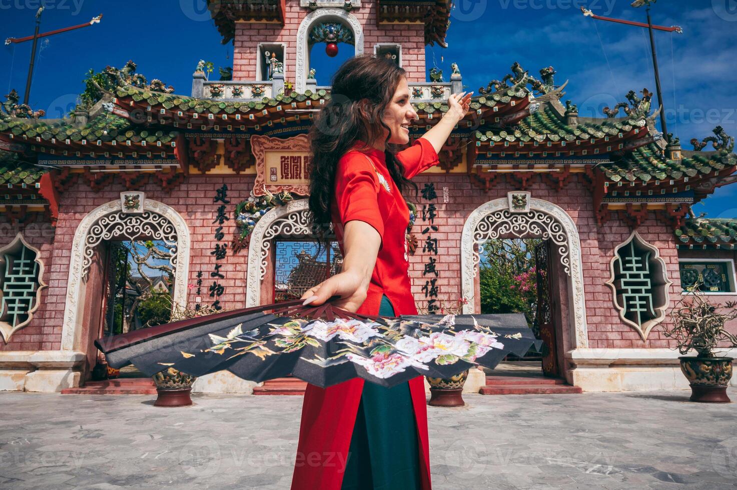 Tourist walking at Fukian Assembly Hall in the Hoi An ancient town, Vietnam photo