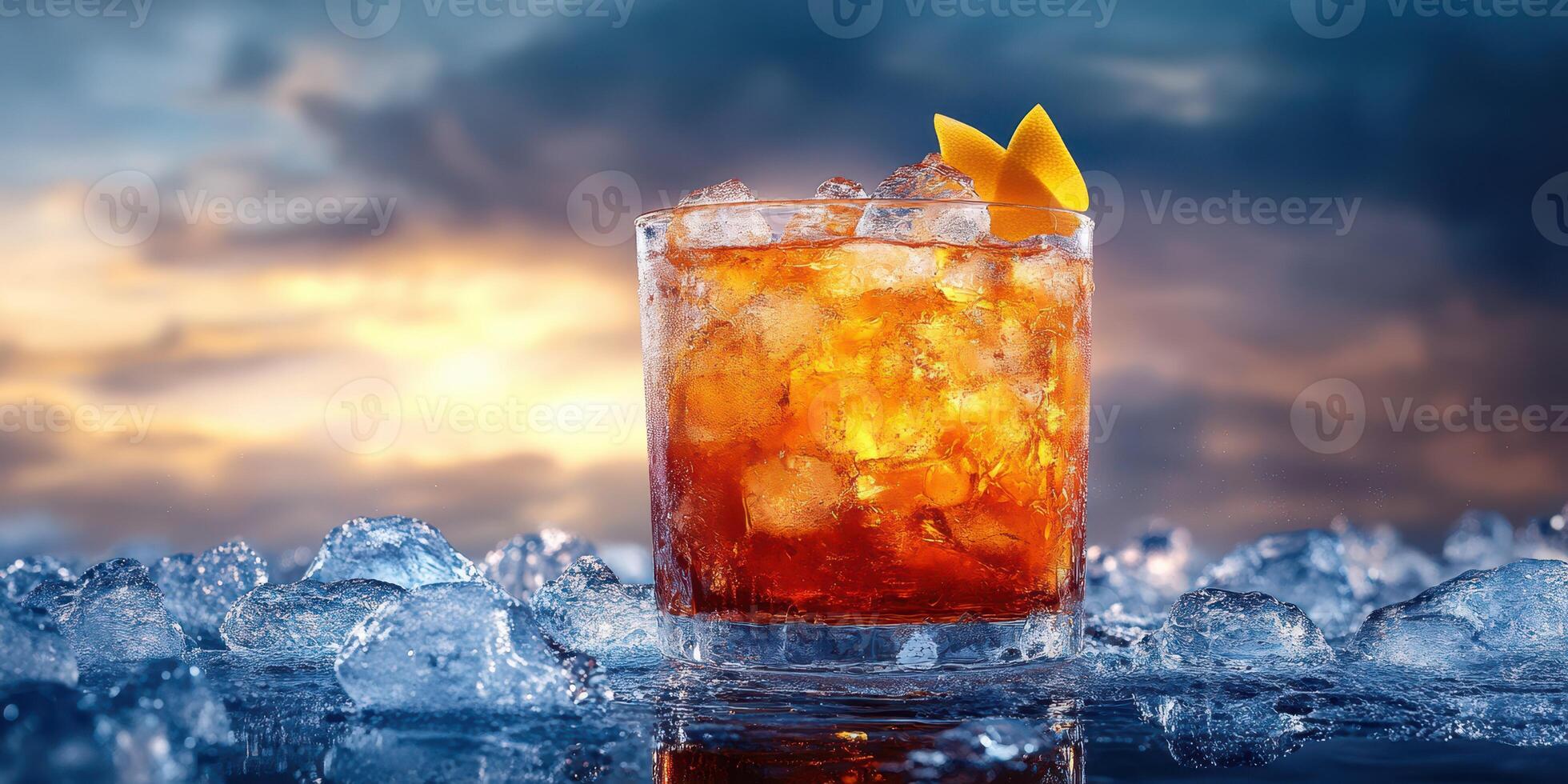 Refreshing cocktail served on ice with a stunning sunset backdrop in a tranquil setting photo