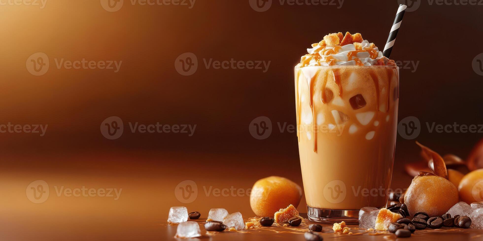 Refreshing iced coffee drink topped with whipped cream and caramel on a warm afternoon photo