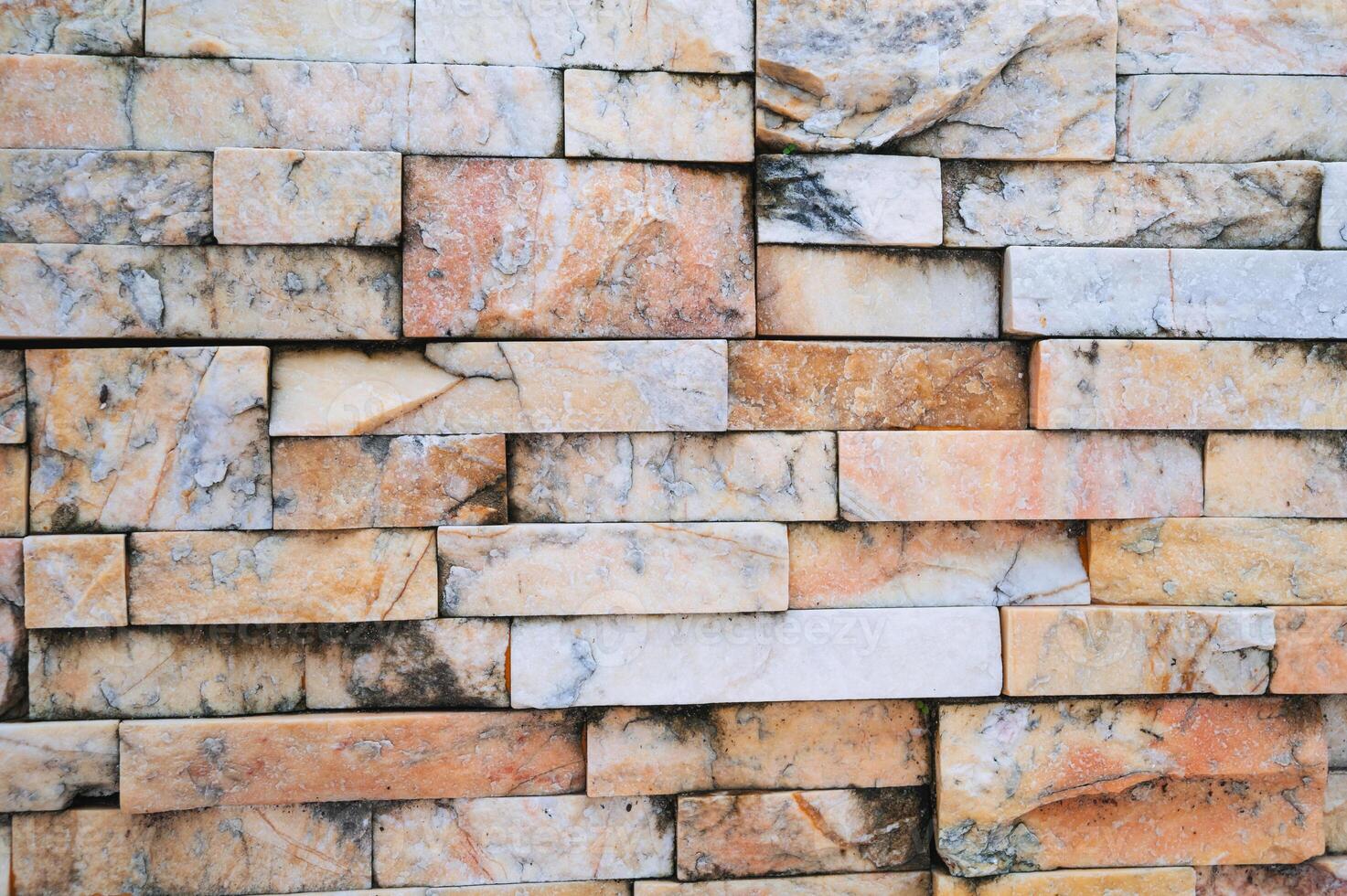 brick background, Abstract geometric pattern texture, Classic outdoor building granite blocks wall. photo