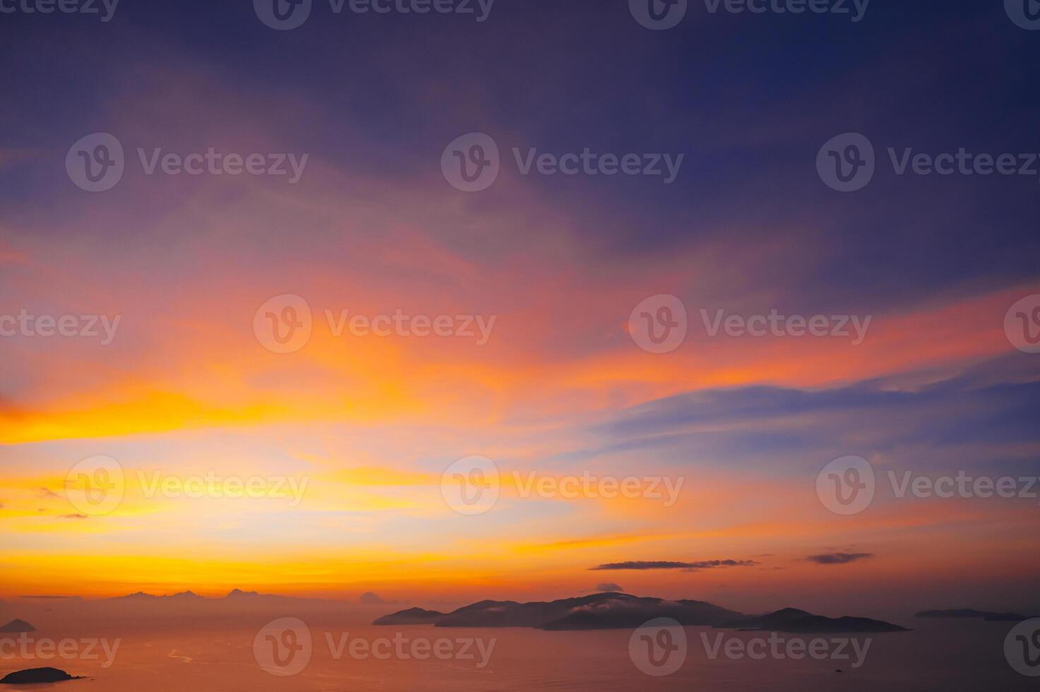 sunset cloudscape Panoramic with rich purple and pink tones blending into orange at horizon, twilight backdrop photo