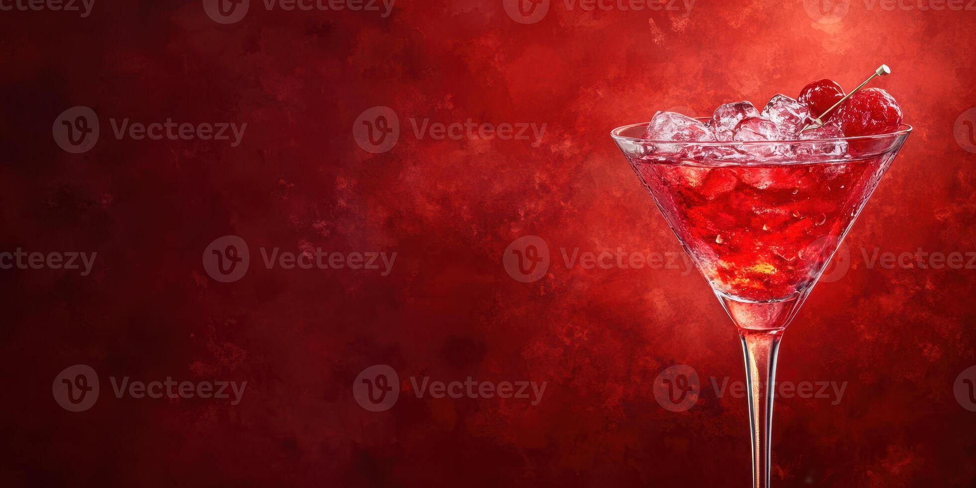 Refreshing raspberry cocktail served in a martini glass with ice against a vibrant red background photo