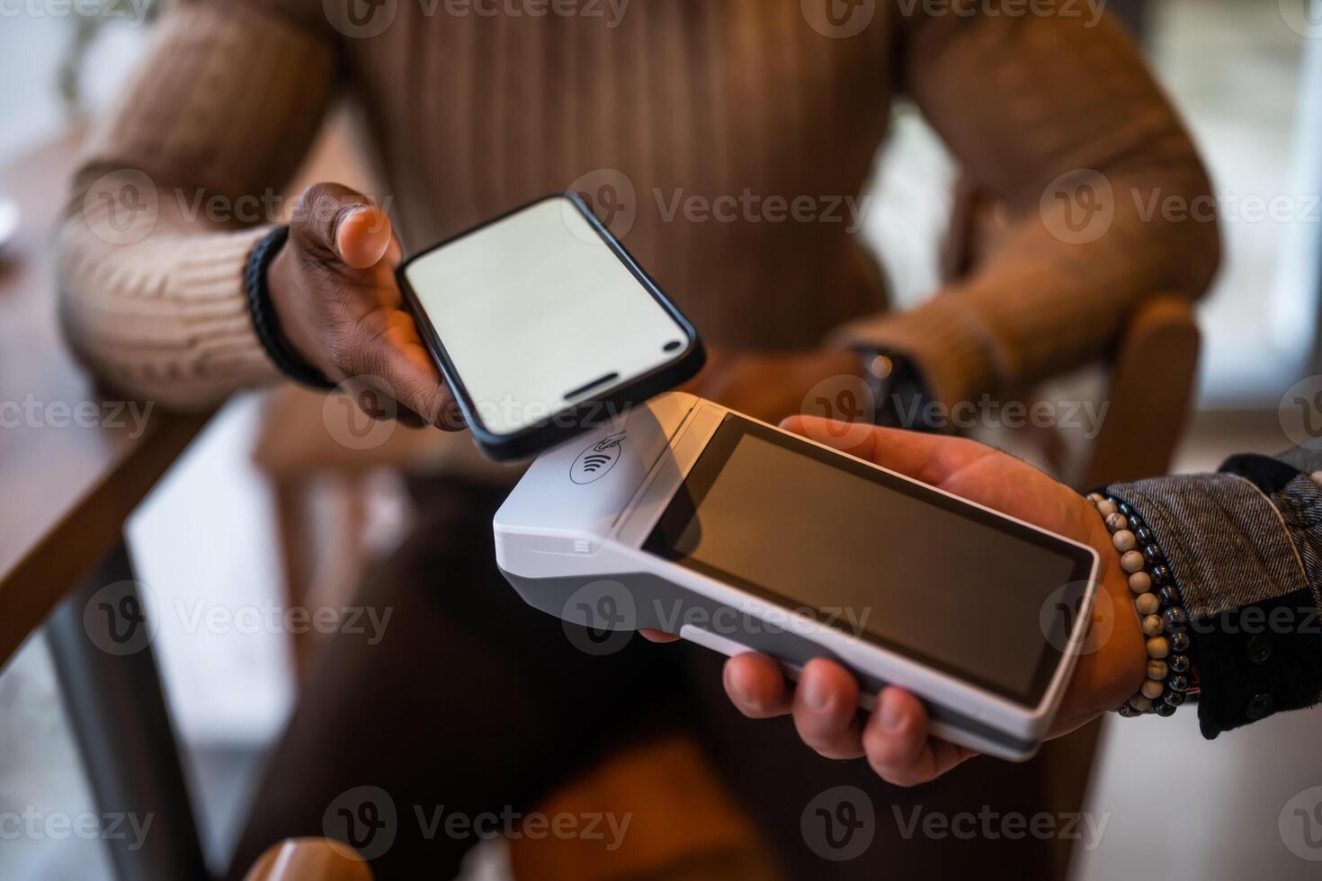 Close up of payment with smartphone photo