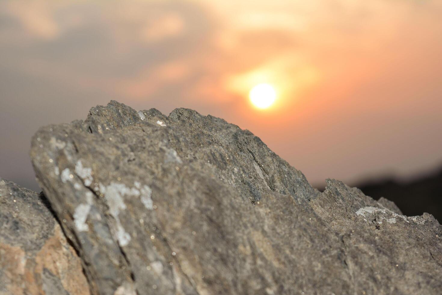 the sun down on the peak of mountain photo