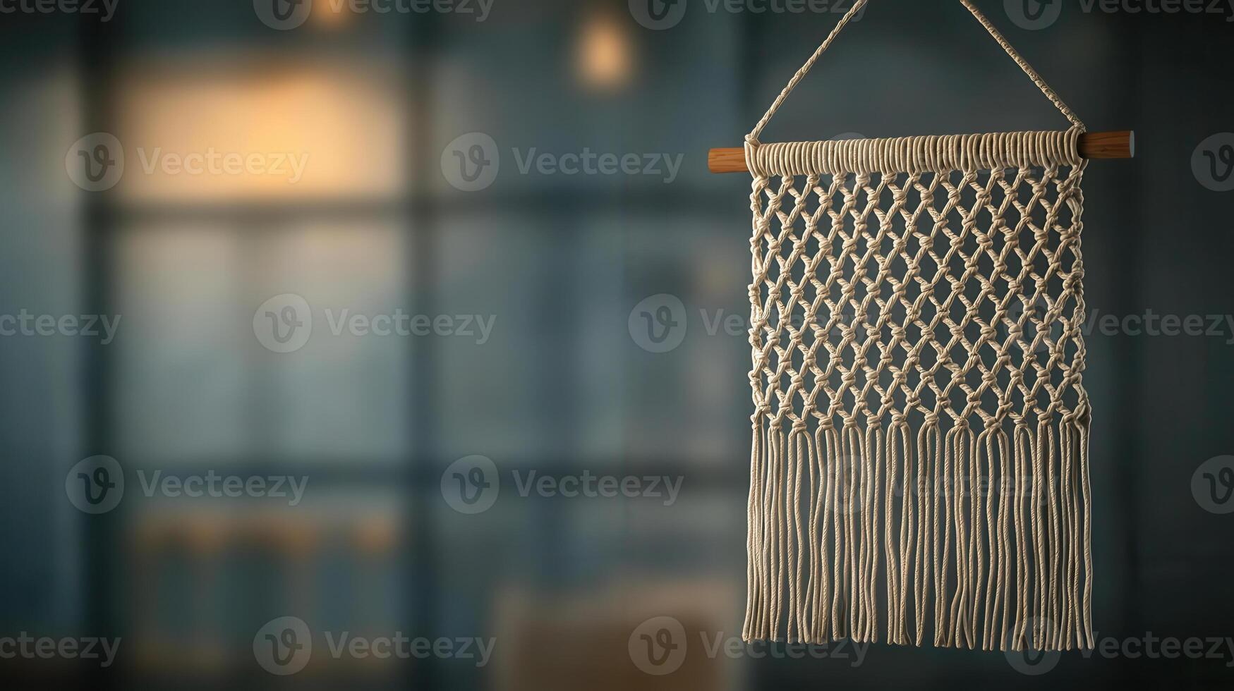 Handcrafted macrame wall hanging with woven textures and fringes photo