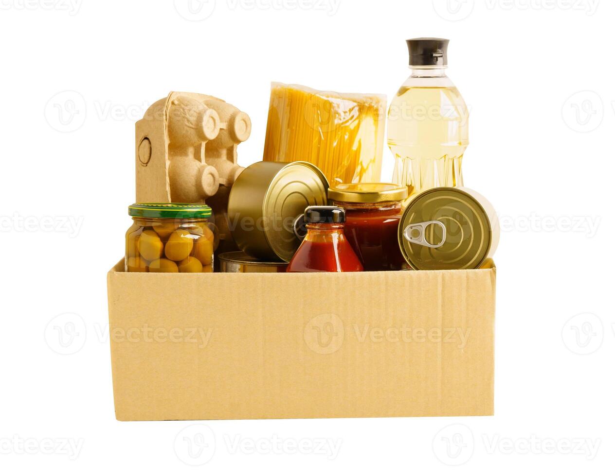 Foodstuffs in donation box isolated on white background with clipping path for volunteer photo
