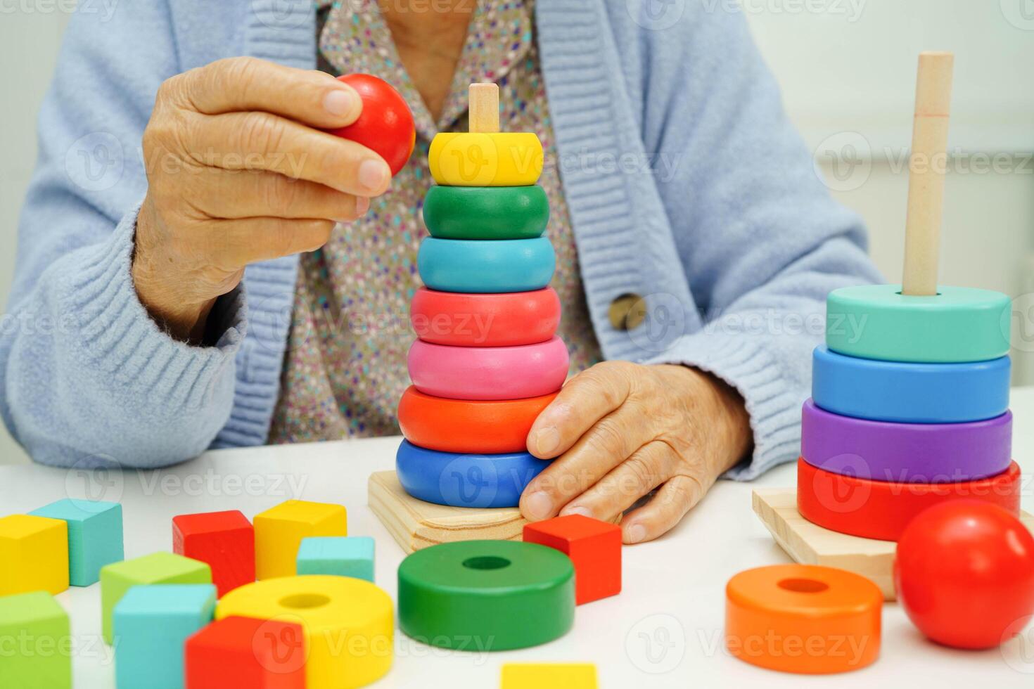 Asian elderly woman playing enhancing skill boa photo