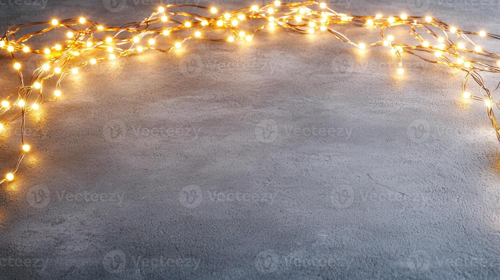 Christmas lights illuminating white creating frame on light blue background, perfect for winter holidays greeting card photo