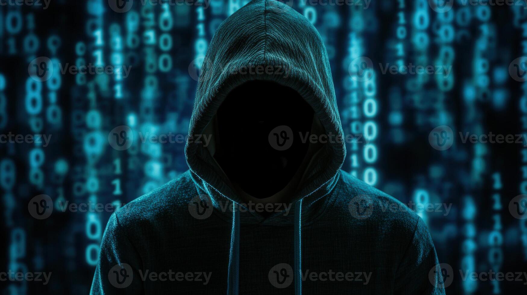 Hooded hacker typing on laptop in shadowy workspace, representing cybersecurity threat digital privacy breach cyber risk photo