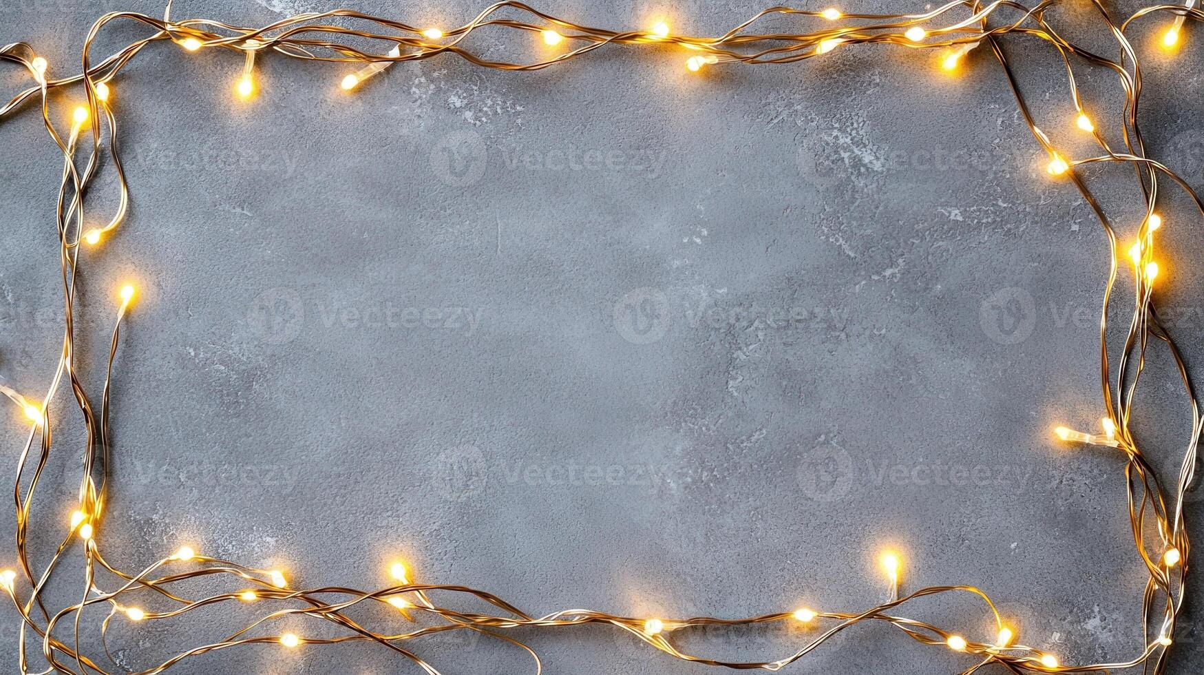 Christmas lights creating a glowing frame on a gray backdrop, perfect for holiday season greetings and festive designs with copy space photo