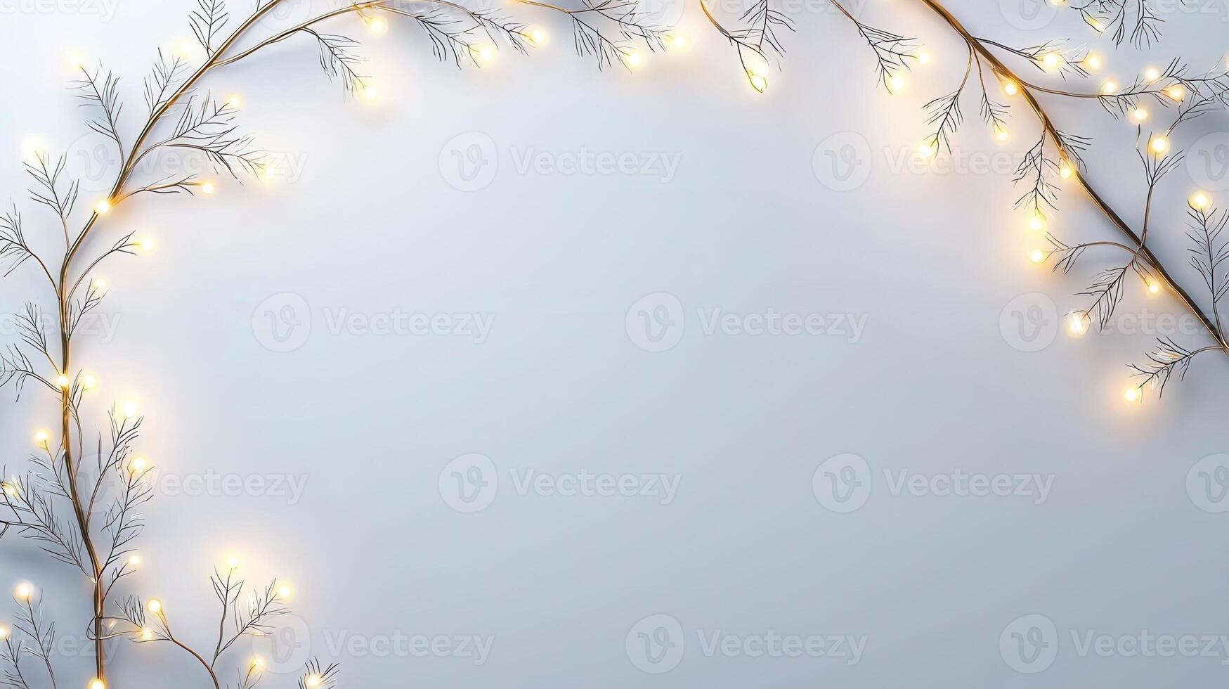 Christmas lights illuminating white creating frame on light blue background, perfect for winter holidays greeting card photo