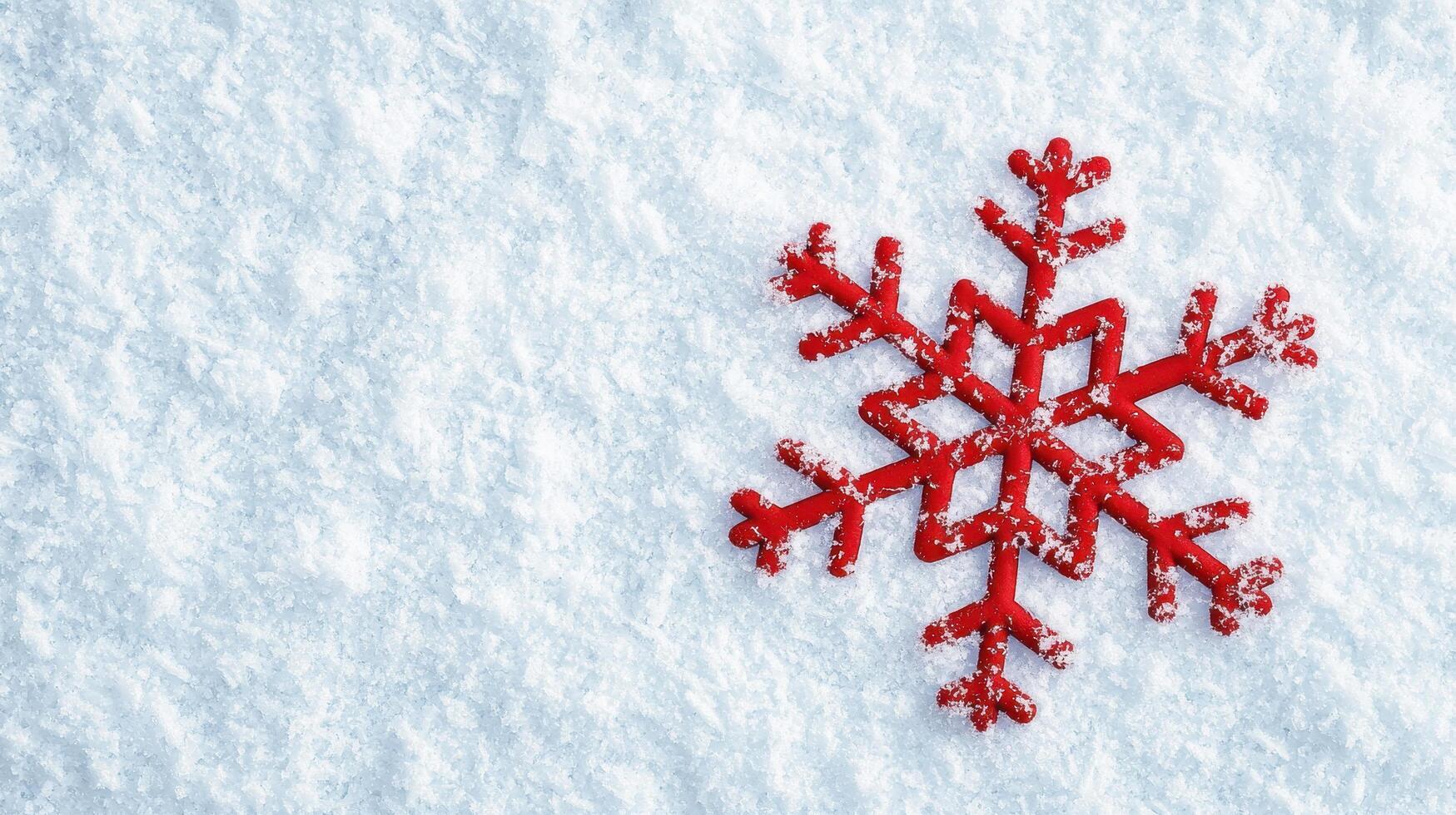 Captivating red snowflake on soft white snow winter wonderland still life photography outdoor close-up seasonal beauty photo