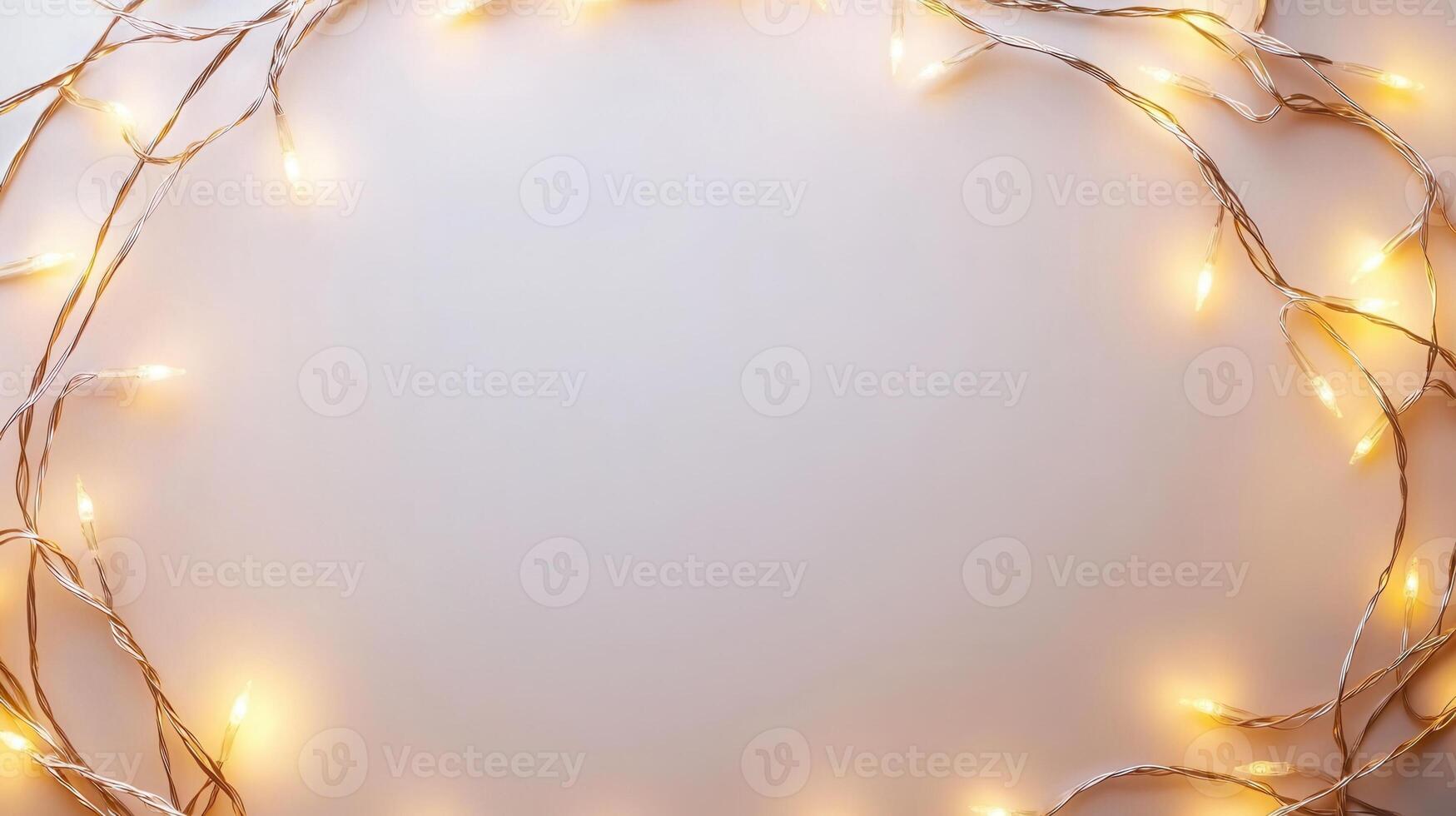 Christmas lights illuminating white creating frame on light blue background, perfect for winter holidays greeting card photo