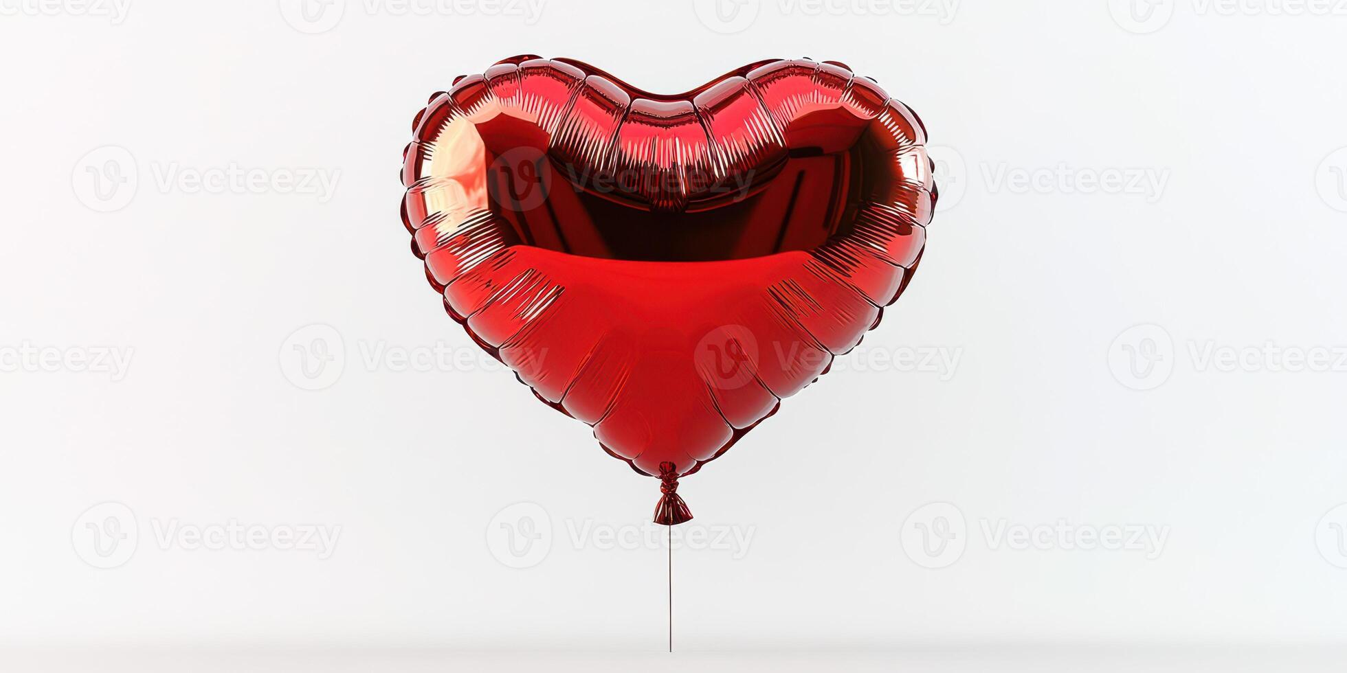 Heart-shaped balloon in glossy red color floats against a clean white background during a celebration of love or special event photo