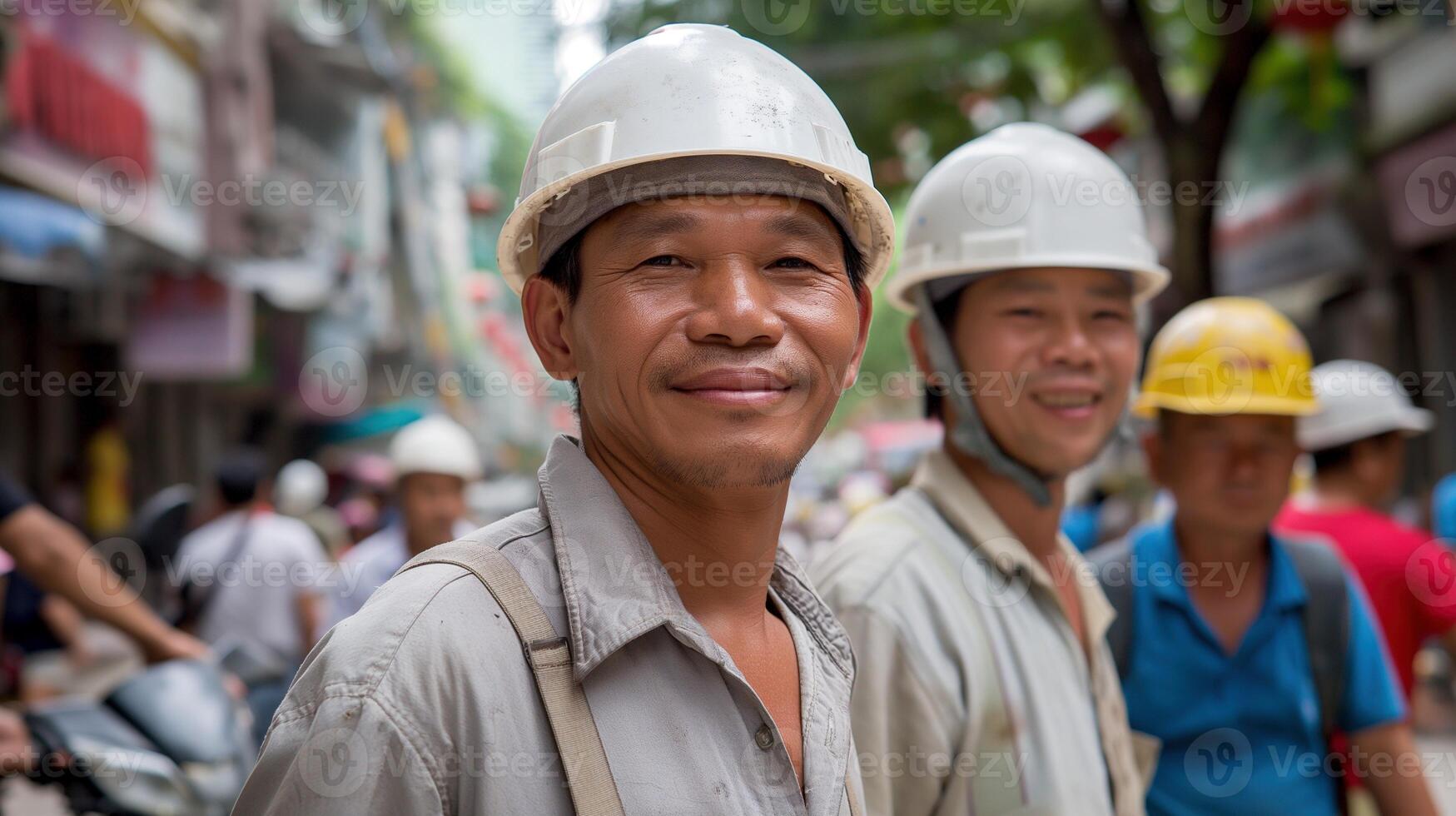 Smiling asian workers in white hardhats on bustling city street portrait image. Colleagues hardworking team picture photorealistic. Skilled laborers occupation concept photo realistic