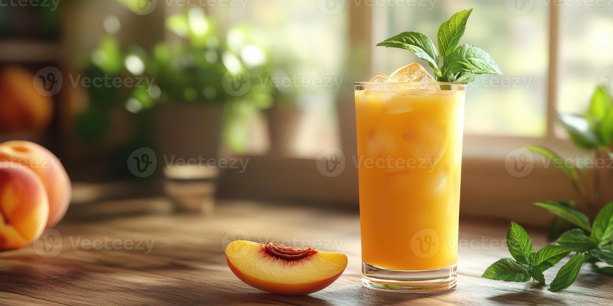 Refreshing peach beverage served in a tall glass, garnished with mint leaves, in a sunny kitchen setting photo