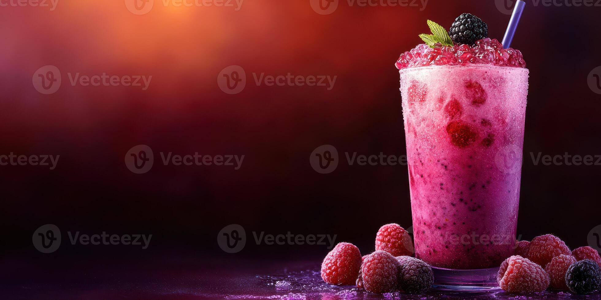 Refreshing berry smoothie served in a tall glass garnished with fresh mint and blackberries on a colorful background photo