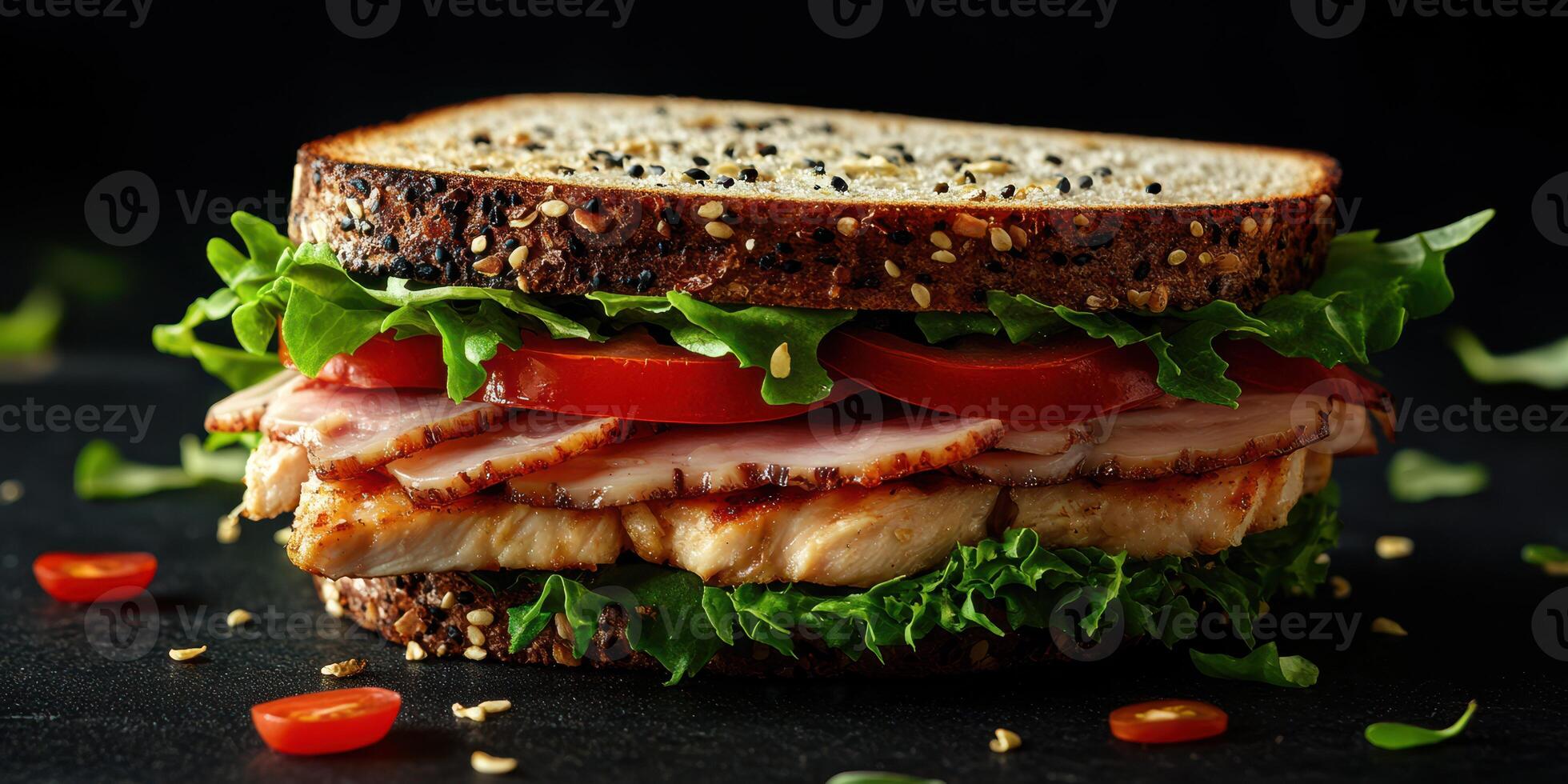 Delicious sandwich featuring grilled chicken, fresh lettuce, and ripe tomatoes on whole grain bread photo