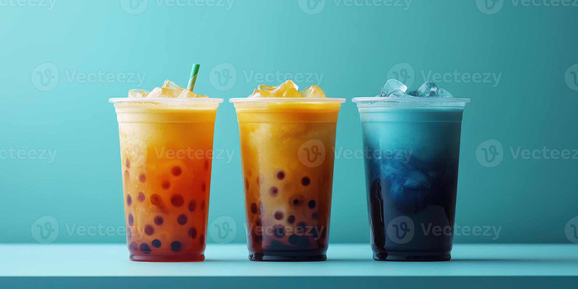 Colorful bubble tea drinks arranged on a countertop with a light blue background photo