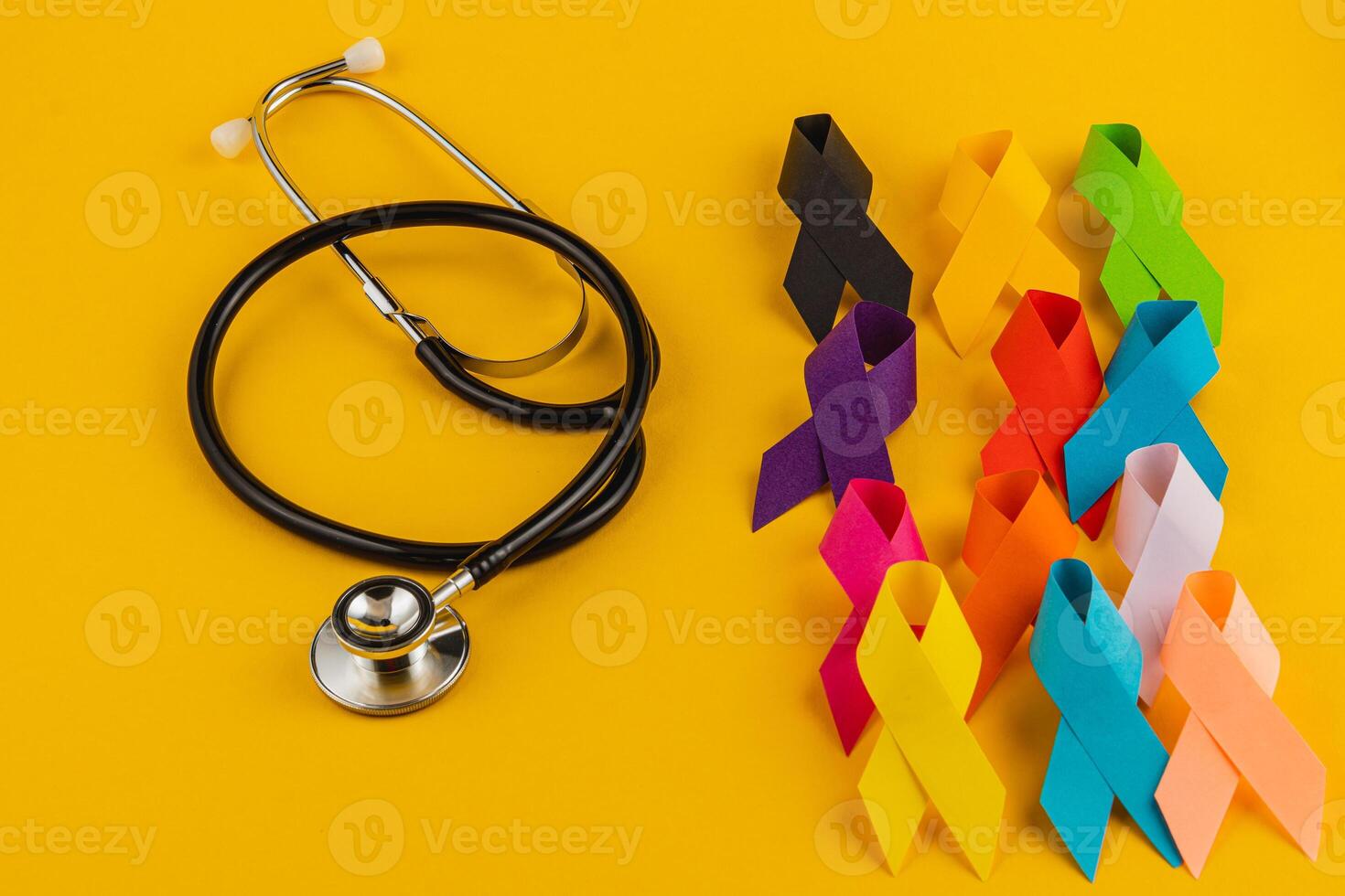 Colorful awareness ribbons and a stethoscope symbolizing health campaigns photo