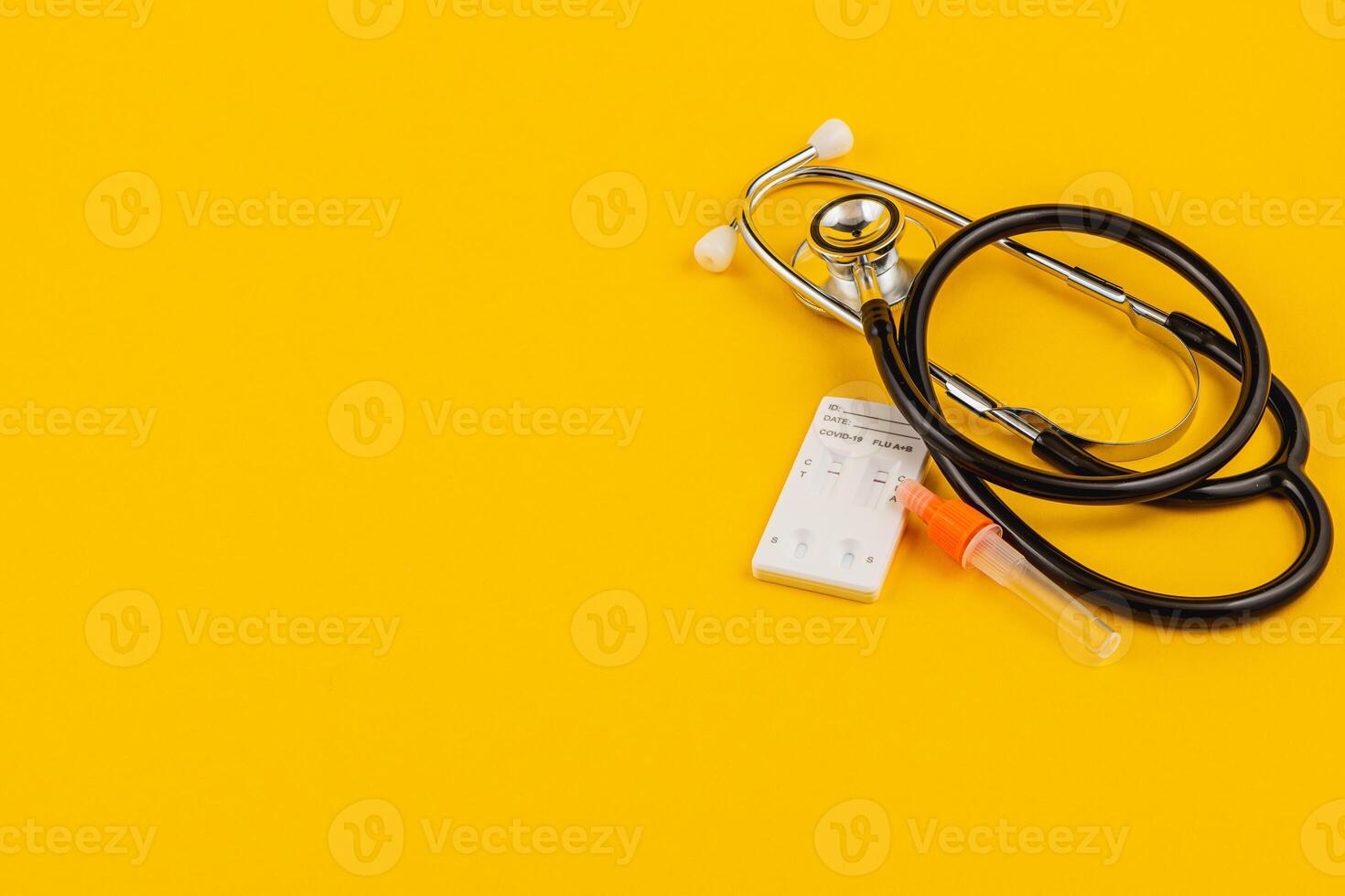 Stethoscope and supplies on bright yellow for health awareness photo