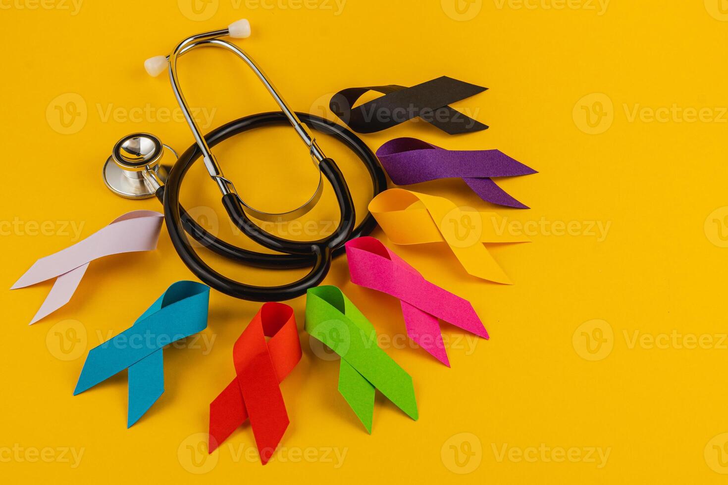 Colorful awareness ribbons and stethoscope representing health campaigns photo