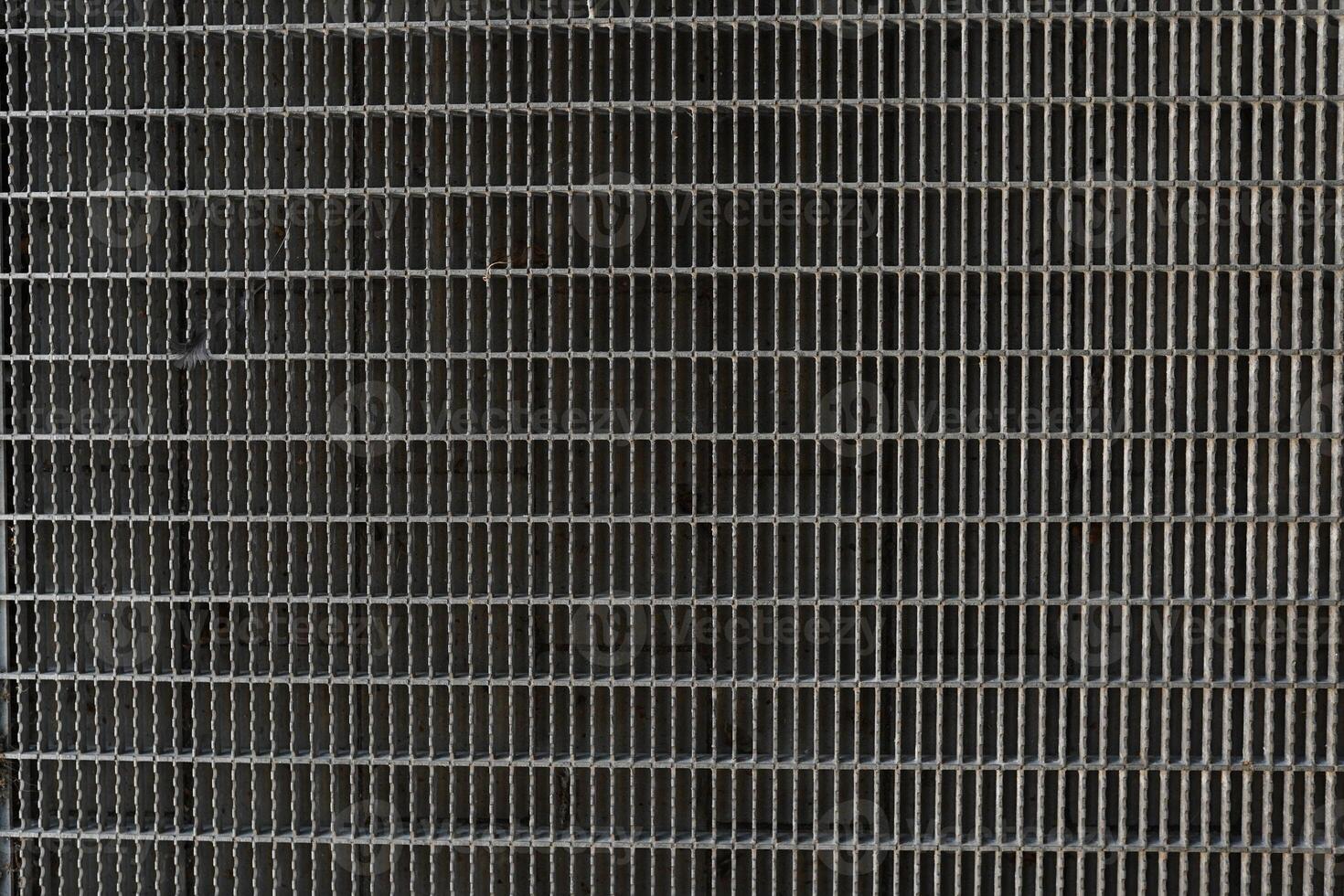 A background image of a gray steel grating panels. photo