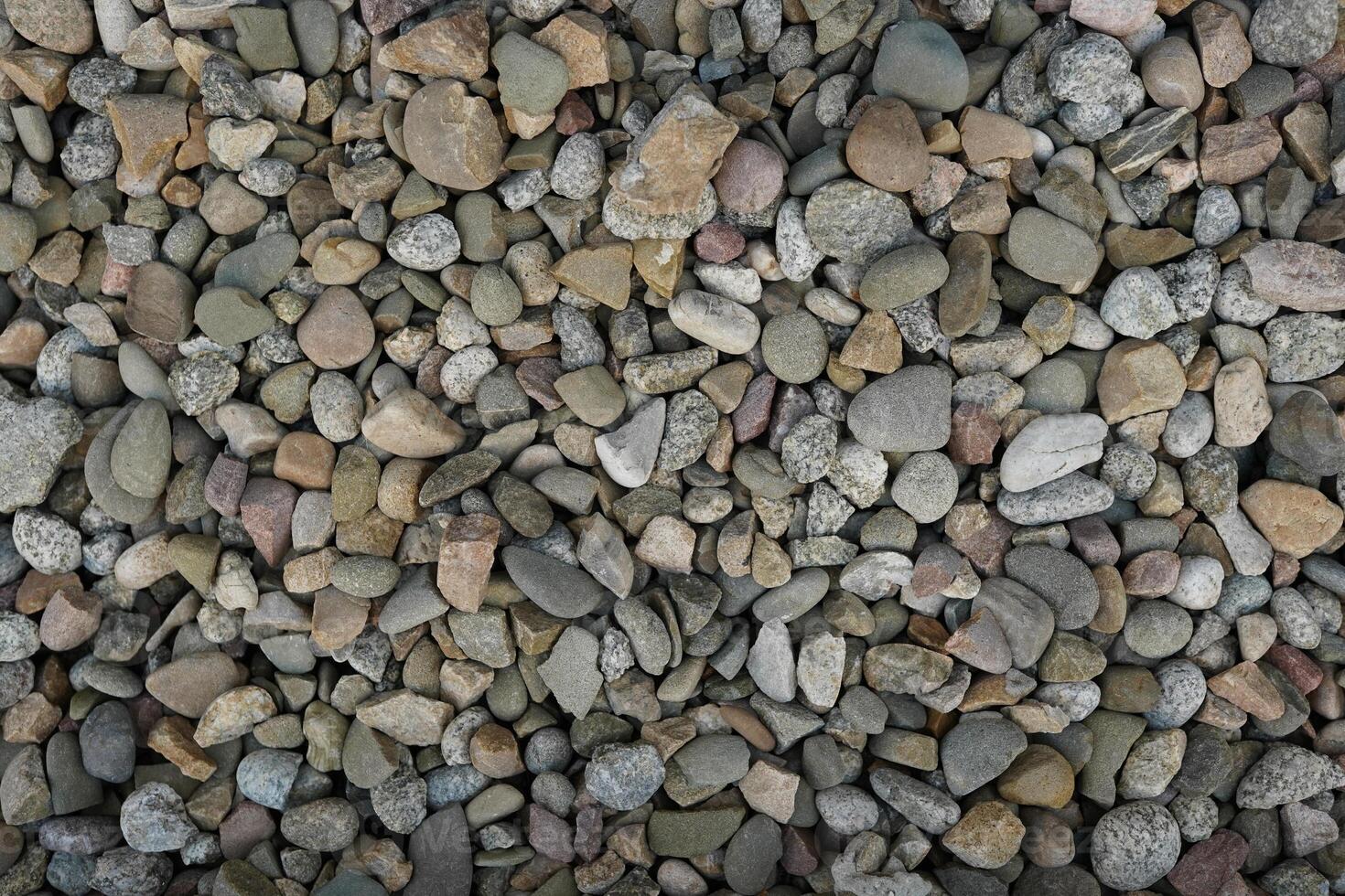 Processed collage of sea shore pebbles texture. Background for banner, backdrop or texture for 3D mapping photo