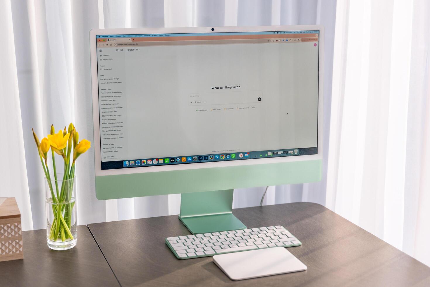 Prague, Czech republic - February 24, 2025. Work place with iMac with open Chat Gpt application on screen. Work assistant with Open Ai. Artificial Intelligence concept. High quality photo
