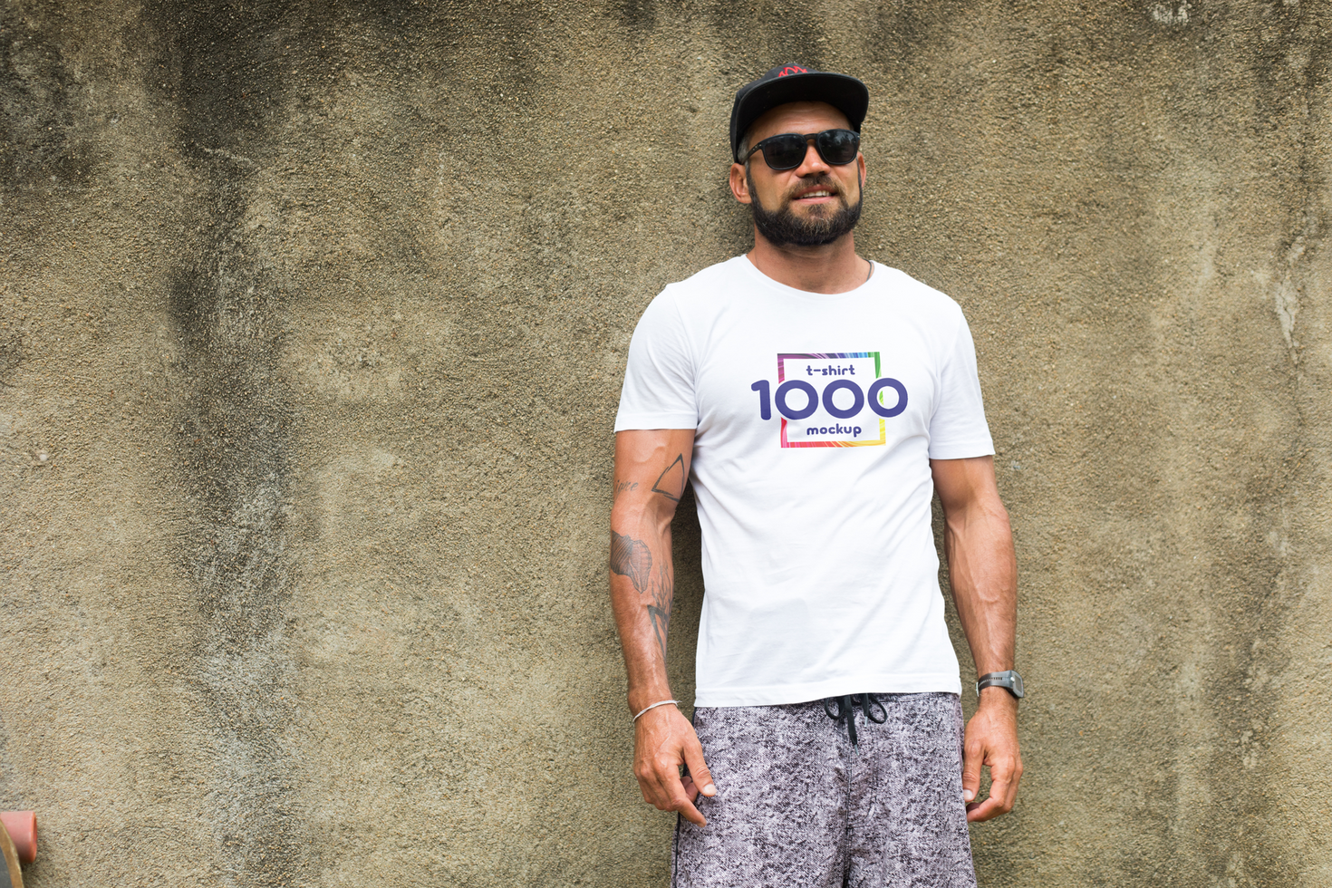 Trendy Man in White T-Shirt Mockup Against Grungy Wall psd