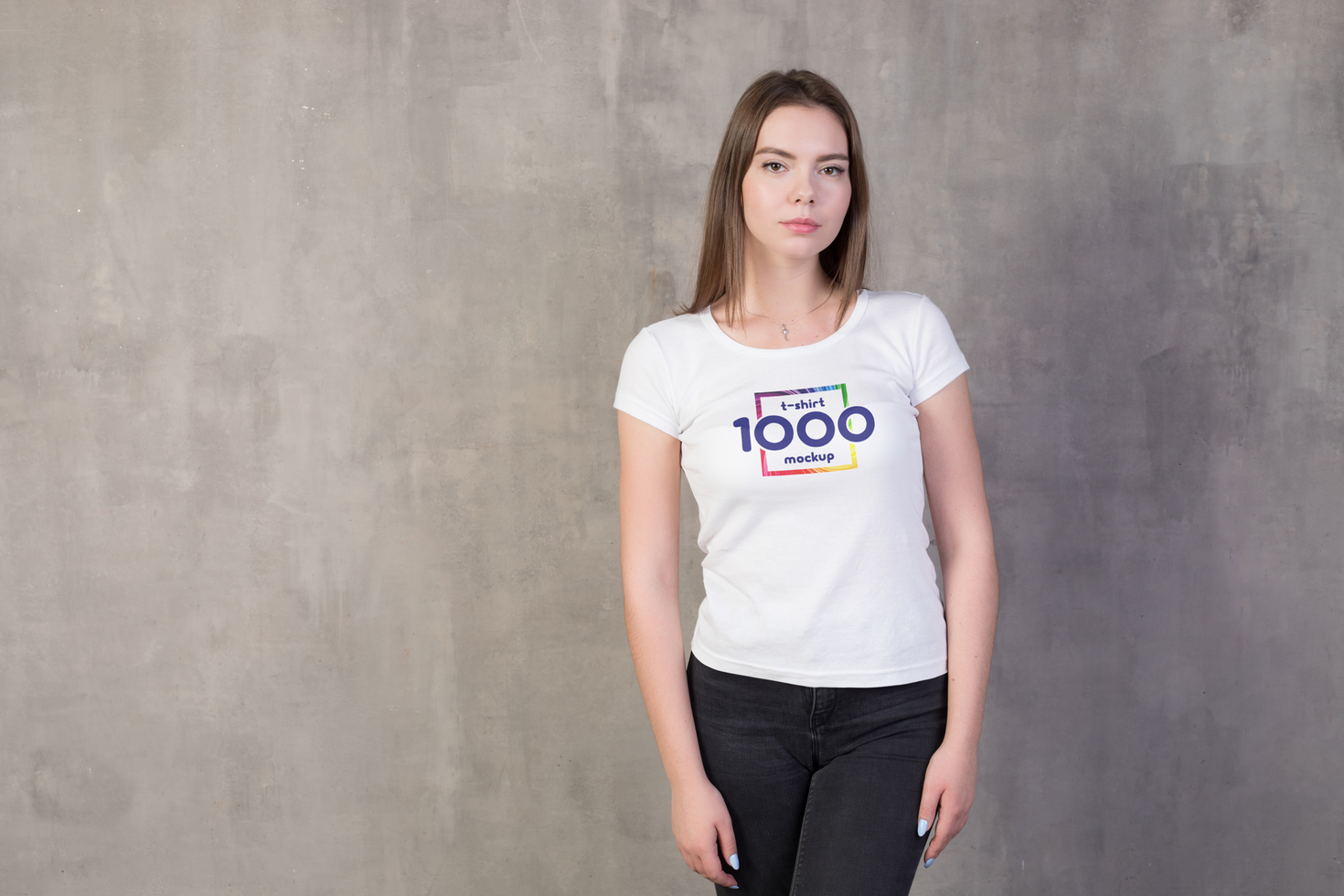 Young Woman in White TShirt Mockup Against Concrete Wall psd
