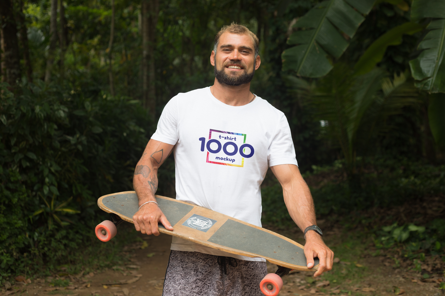Happy Man with Skateboard and T-Shirt Mockup in Tropical Setting psd