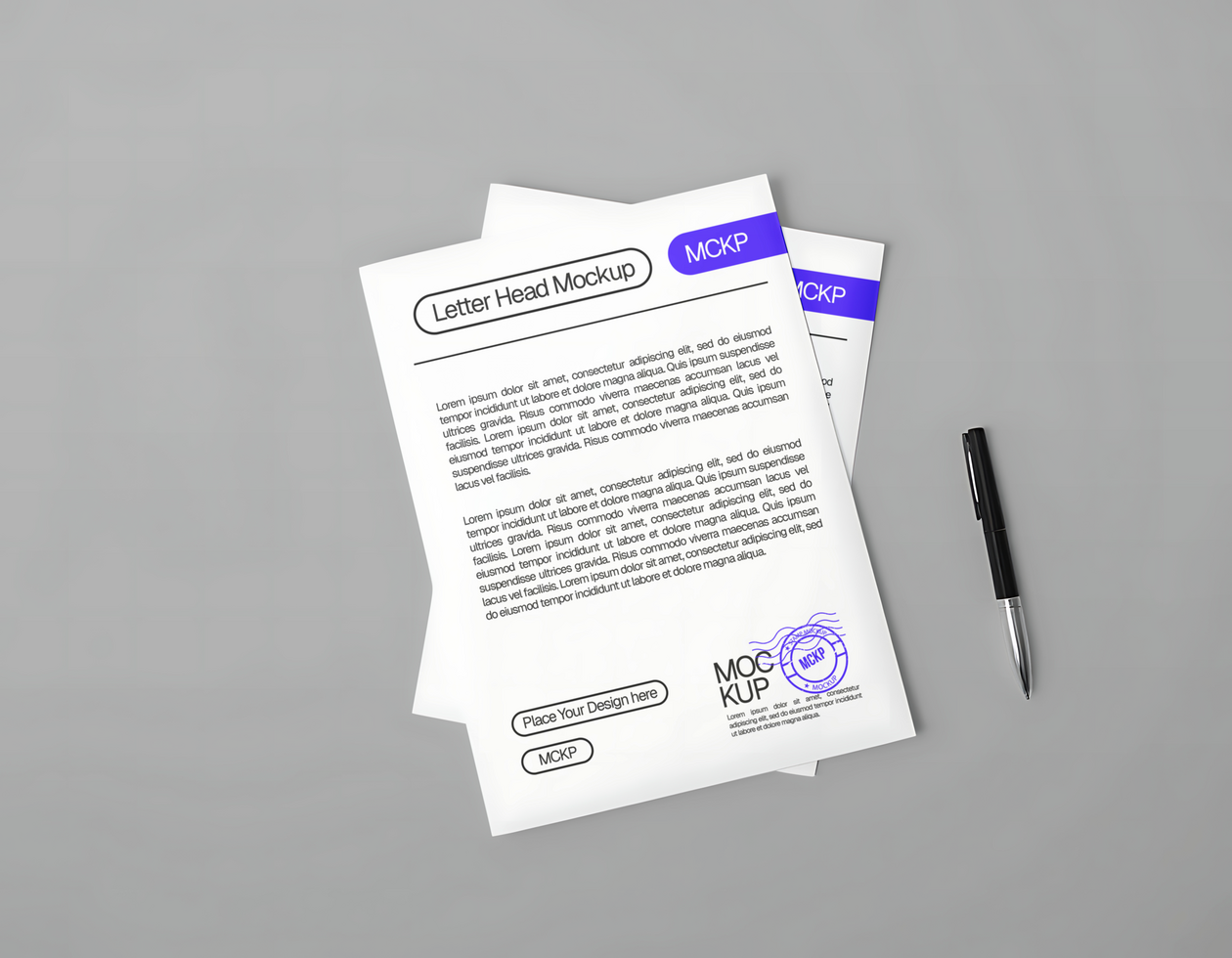 A letterhead mockup with a pen rests on a gray surface psd