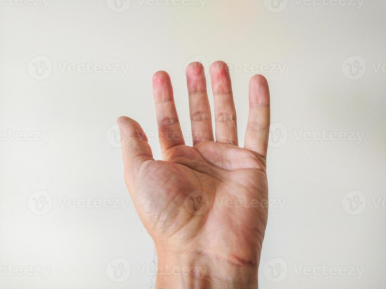 Closeup of a male hand open against a neutral background. The image is clean, simple, and perfect for illustrating concepts of giving, receiving, or human connection. photo