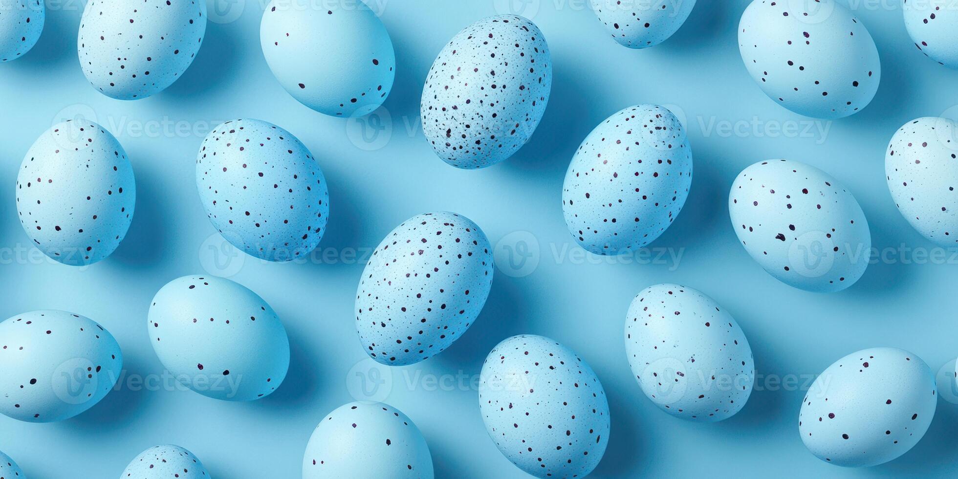 Colorful blue speckled eggs arranged on a light blue background for spring celebrations or artistic displays photo